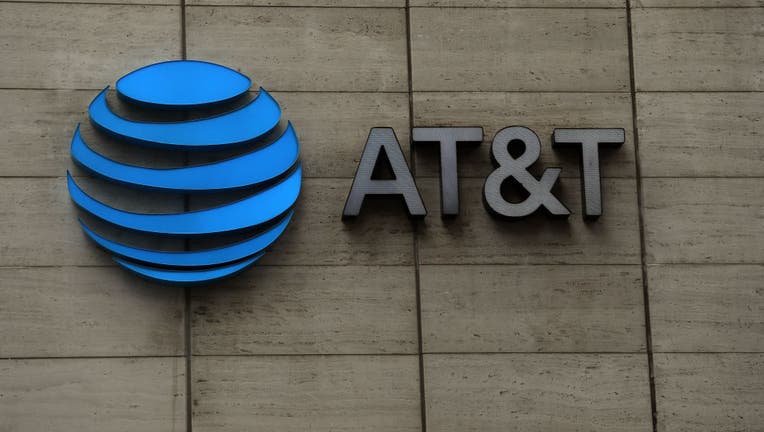 FILE - The logo of AT&T outside of AT&T corporate headquarters.