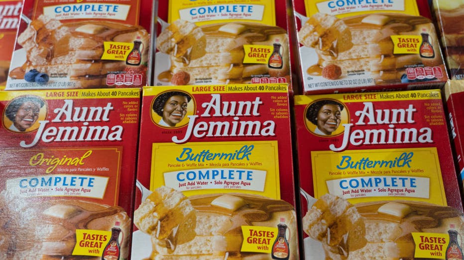 Aunt Jemima products seen displayed on supermarket shelves.