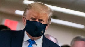 Trump wears a face mask in public for the first time