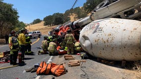 Crews extricate driver of overturned concrete truck in Contra Costa County