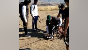VIDEO: High school football players help man in wheelchair up Mission Peak