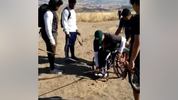 VIDEO: High school football players help man in wheelchair up Mission Peak