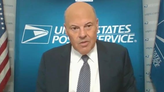 Postmaster says election mail will go through despite cuts