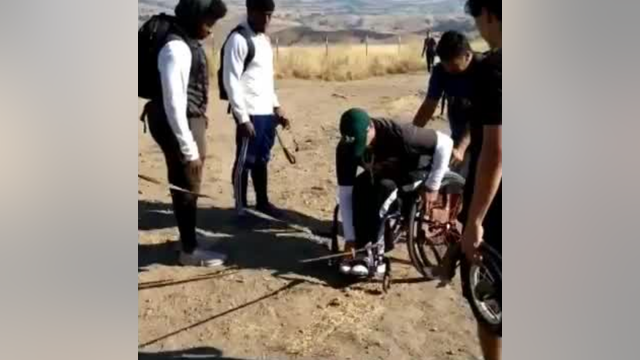 VIDEO: High school football players help man in wheelchair up Mission Peak