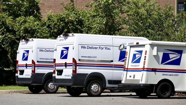 FILE - Vehicles of US Postal Service (USPS) is seen in New York, USA on August 18, 2020. 