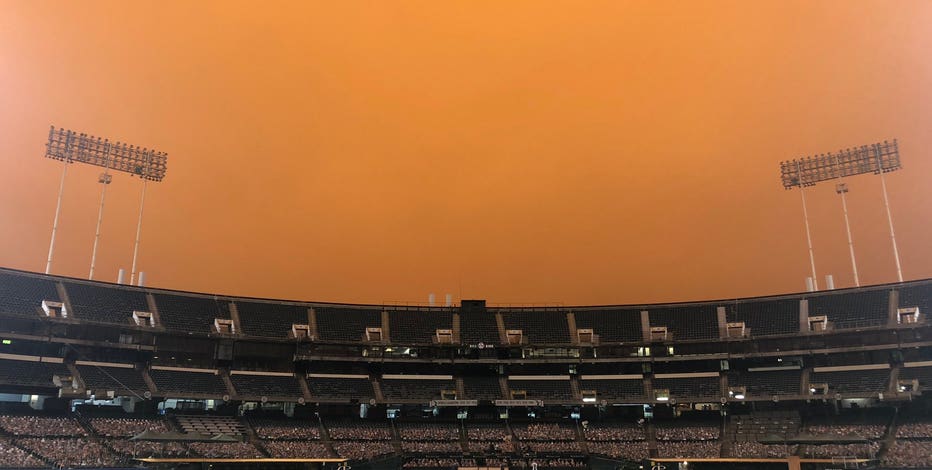 Smoke from nearby wildfires creates eerie baseball scene