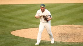 Pinder delivers timely hit, A's advance in playoffs at last