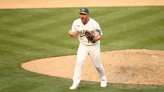 Pinder delivers timely hit, A's advance in playoffs at last