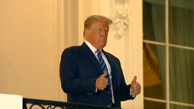 President back at White House, compares COVID to seasonal flu