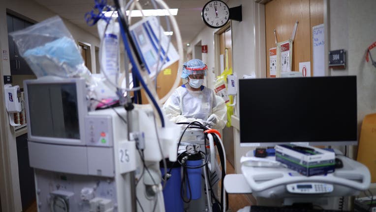 A member of the dialysis prepares to treat a patient with coronavirus.