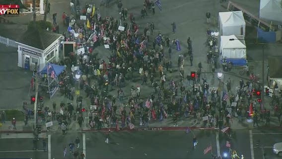 Hundreds gather in Huntington Beach to protest state curfew