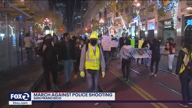 Demonstrators march on Market Street against San Francisco police shooting