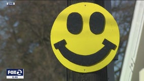 High school senior cheers up Danville by hanging smiley faces