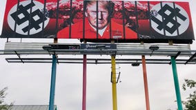 New billboard in downtown Phoenix shows Trump behind bars in prison jumpsuit