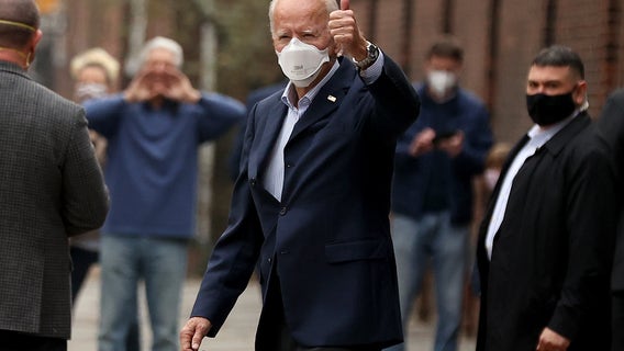 'Democracy prevailed': Biden aims to unify divided nation