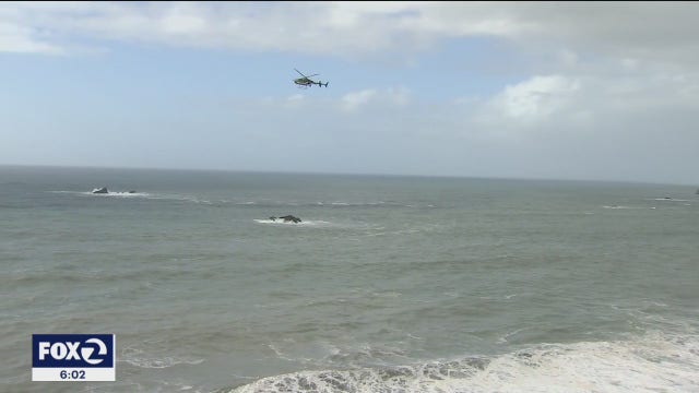 Two rescues underway as high surf warning hits coast