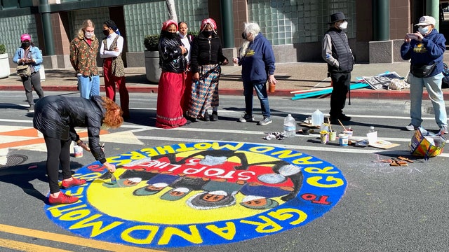 Hundreds paint murals on downtown Oakland street opposing oil pipelines