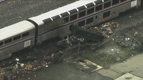 Dump truck bursts into flames after collision with Amtrak train in Oakland