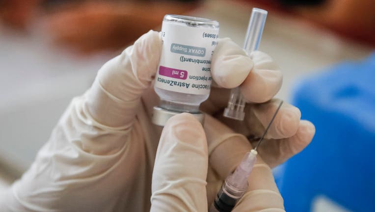 FILE - A health worker prepares AstraZeneca COVID-19 vaccine during mass COVID-19 vaccination program in Sanur, Denpasar, Bali, Indonesia on March 22 2021. (Photo by Johanes Christo/NurPhoto via Getty Images)