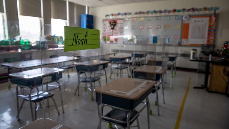 STAMFORD, CONNECTICUT - MARCH 10: Plastic dividers stand on classroom desks, due to pandemic protocols, before the first day of in-person learning for five days per week at Stark Elementary School on March 10, 2021 in Stamford, Connecticut. (Photo by John Moore/Getty Images)