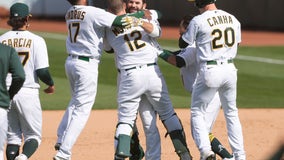 A's rally to beat Dodgers 4-3 in 10 for 1st win of season