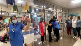 Elementary students, staff cheer for cafeteria manager who passed US citizenship test