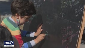 Grieving from recent gun violence, community members in San Francisco write kind messages in chalk