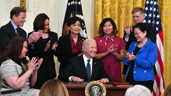 Biden signs bill to counter rise in anti-Asian hate crimes