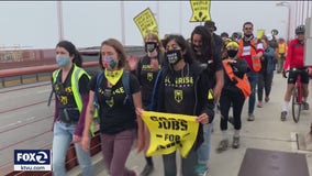 Activists marching against climate change cross Golden Gate Bridge