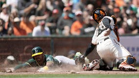 Irvin fans 8, A's beat Giants 6-2 to avoid 3-game sweep