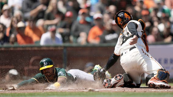 Irvin fans 8, A's beat Giants 6-2 to avoid 3-game sweep