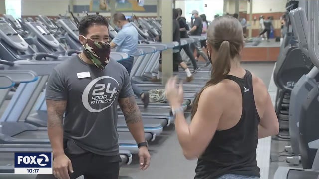 Despite being fully vaccinated, many service industry employees are keeping masks on