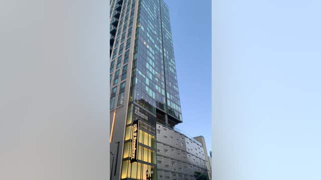 Projectile shatters Oakland apartment building window, firefighters block Broadway Street