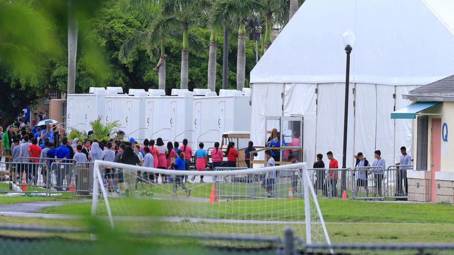 In this file photo from June 23, 2018, children are seen at the Homestead shelter for migrant children in Homestead, Fla. A Biden administration task force is focusing on reunifying migrant families separated at the border under Trump-era policies. (Al Diaz/Miami Herald/Tribune News Service via Getty Images)