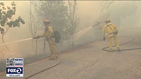 Crews mopping up 25-acre vegetation fire that jumped Coyote Creek from Milpitas to San Jose