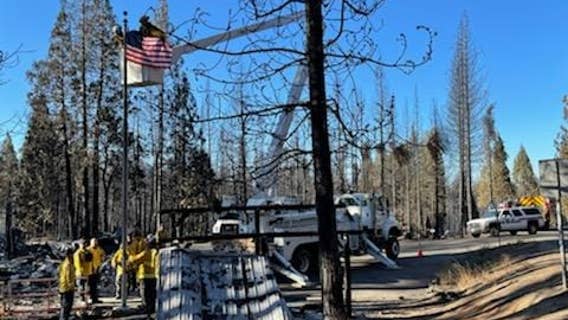 Bay Area firefighters battling Caldor Fire raise American Flag where post office once stood