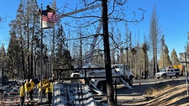 Bay Area firefighters battling Caldor Fire raise American Flag where post office once stood