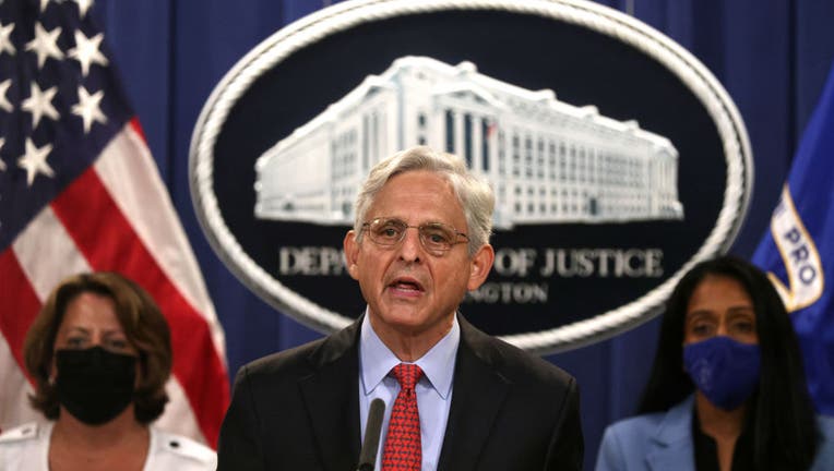 FILE - U.S. Attorney General Merrick Garland (C) speaks as Deputy Attorney General Lisa Monaco (L) and Associate Attorney General Vanita Gupta (R) listen during a news conference to announce a civil enforcement action at the Department of Justice on Sept. 9, 2021, in Washington, D.C. (Photo by Alex Wong/Getty Images)