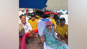 Alabama lifeguards help 95-year-old down to beach every day during her stay