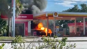 Fire erupts after driver backs into gas pump, killing woman pumping gas