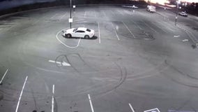 Driver doing donuts hits light pole, gets arrested