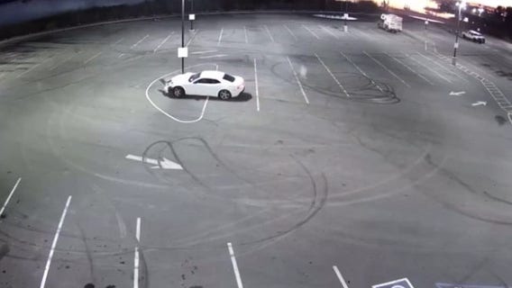 Driver doing donuts hits light pole, gets arrested