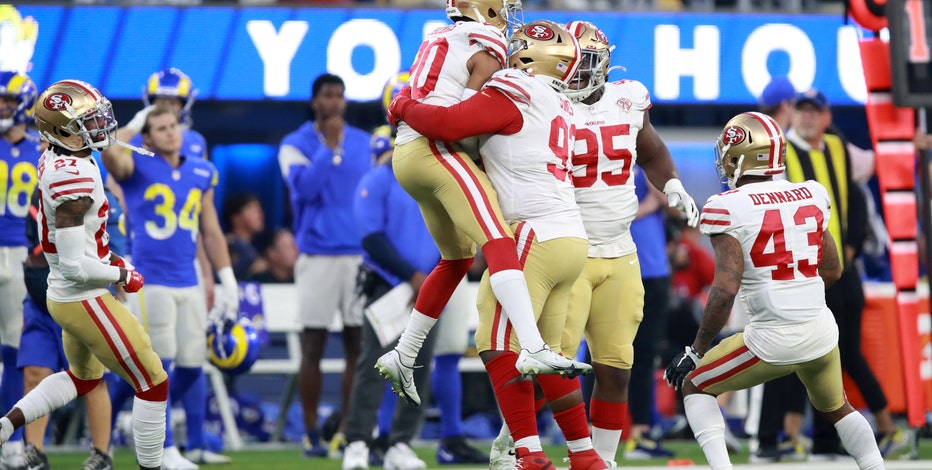 49ers clinch playoff berth by holding off Rams 27-24 in OT