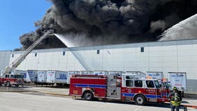 Nearly 200 firefighters battling blaze at Walmart distribution center
