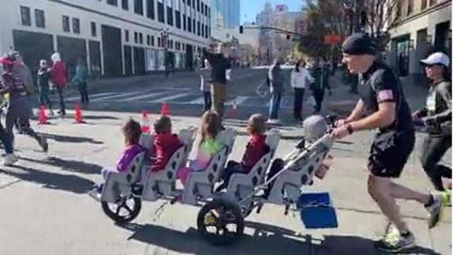 Record-breaking dad runs Oakland's half-marathon pushing quintuplets in stroller