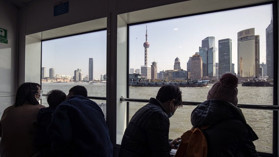 Shanghai allows 4 million out of homes as virus rules ease