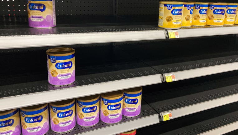 A baby formula display shelf is seen at a Walmart grocery