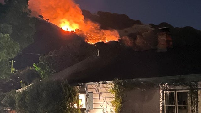 Oakland firefighers stamp out wildland fire as they prepare for conditions to worsen