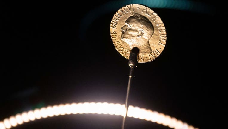 FILE IMAGE - An official Nobel Peace Prize gold medal is seen at the exhibition at the Nobel Peace Center in Oslo on Dec. 9, 2021, on the eve of the Nobel Peace Prize ceremony. (Photo by ODD ANDERSEN/AFP via Getty Images)