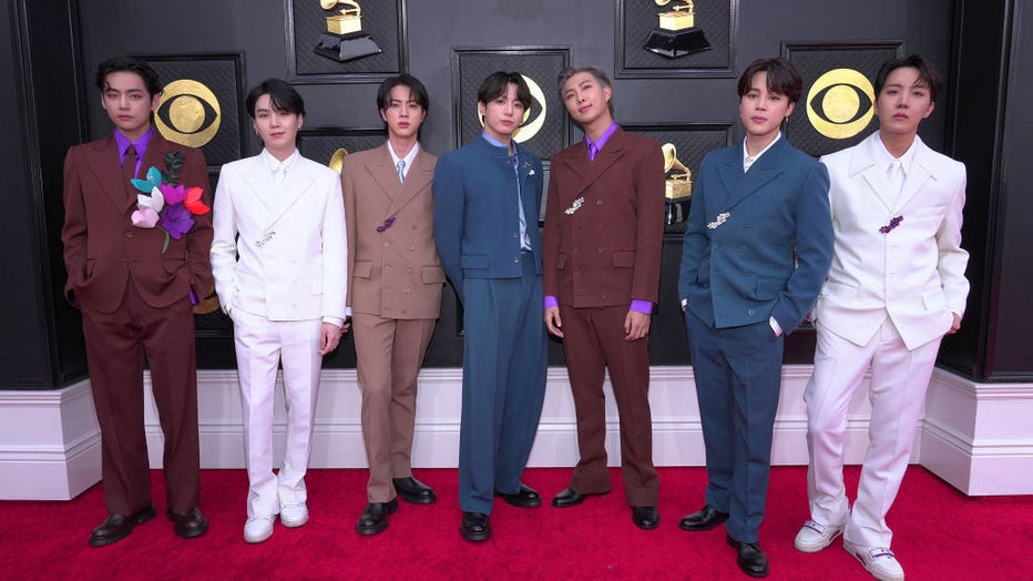 FILE - (L-R) V, Suga, Jin, Jungkook, RM, Jimin and J-Hope of BTS attend the 64th Annual GRAMMY Awards at MGM Grand Garden Arena on April 3, 2022, in Las Vegas, Nevada. (Photo by Kevin Mazur/Getty Images for The Recording Academy)